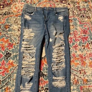Ripped jeans worn x10 (about)